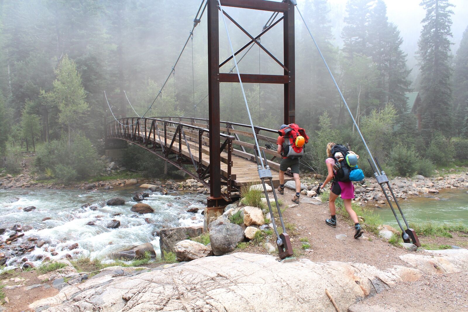 hikers entering san juan national forest