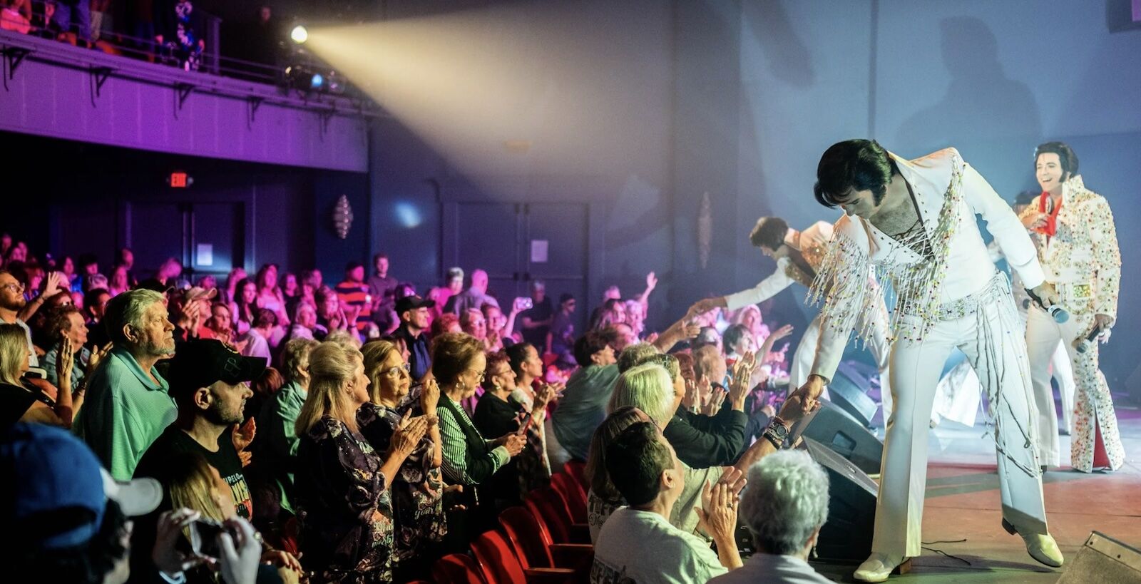 elvis impersonators onstage at tupelo elvis festival