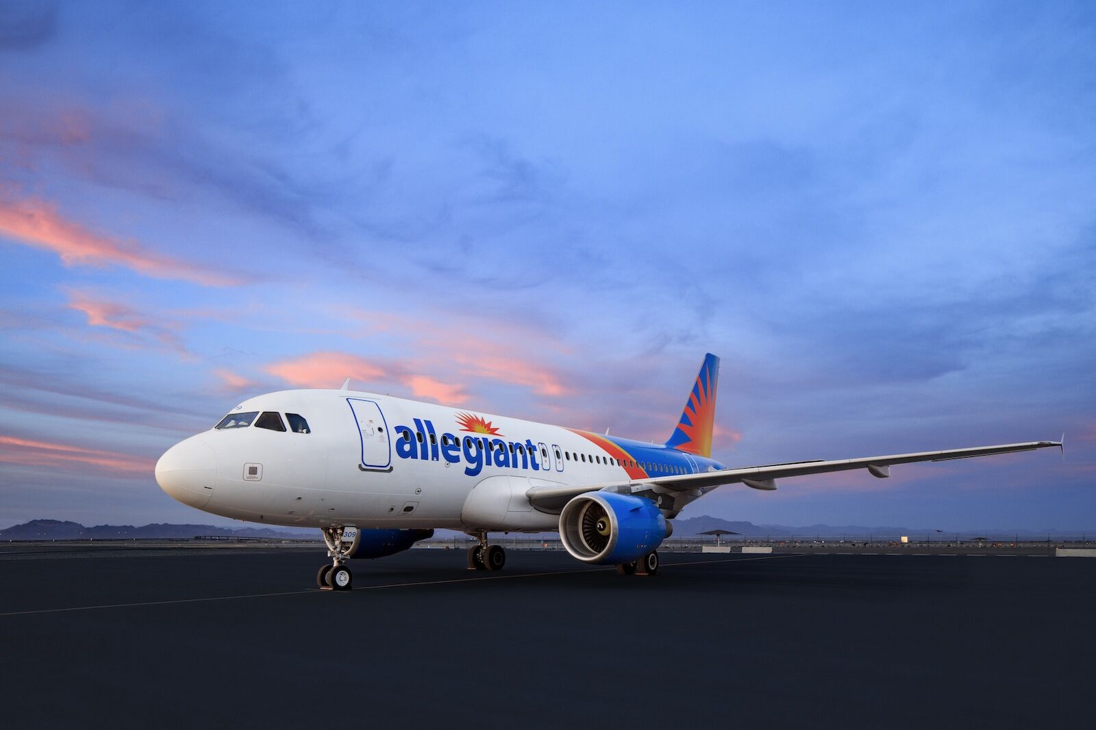 allegiant-sun country merger -- plane at sunset