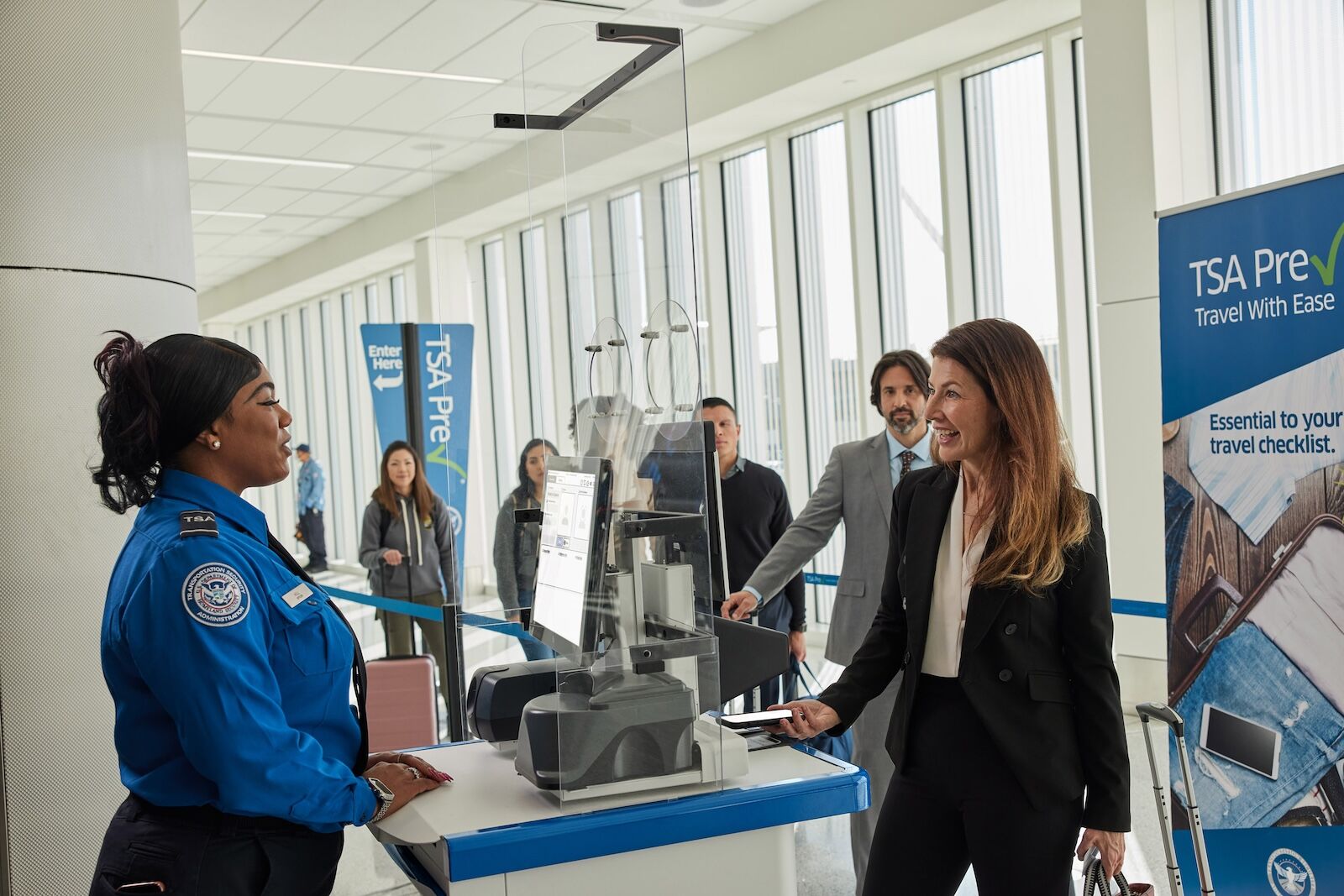 touchless ID android   - woman scanning phone in line