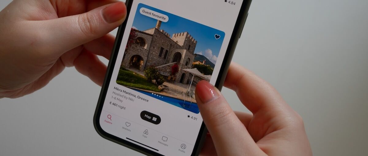 airbnb app on phone in hands
