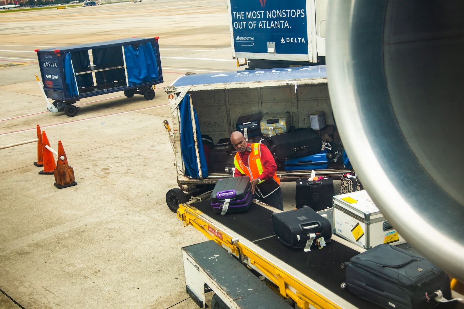 airport lost luggage - bag handler