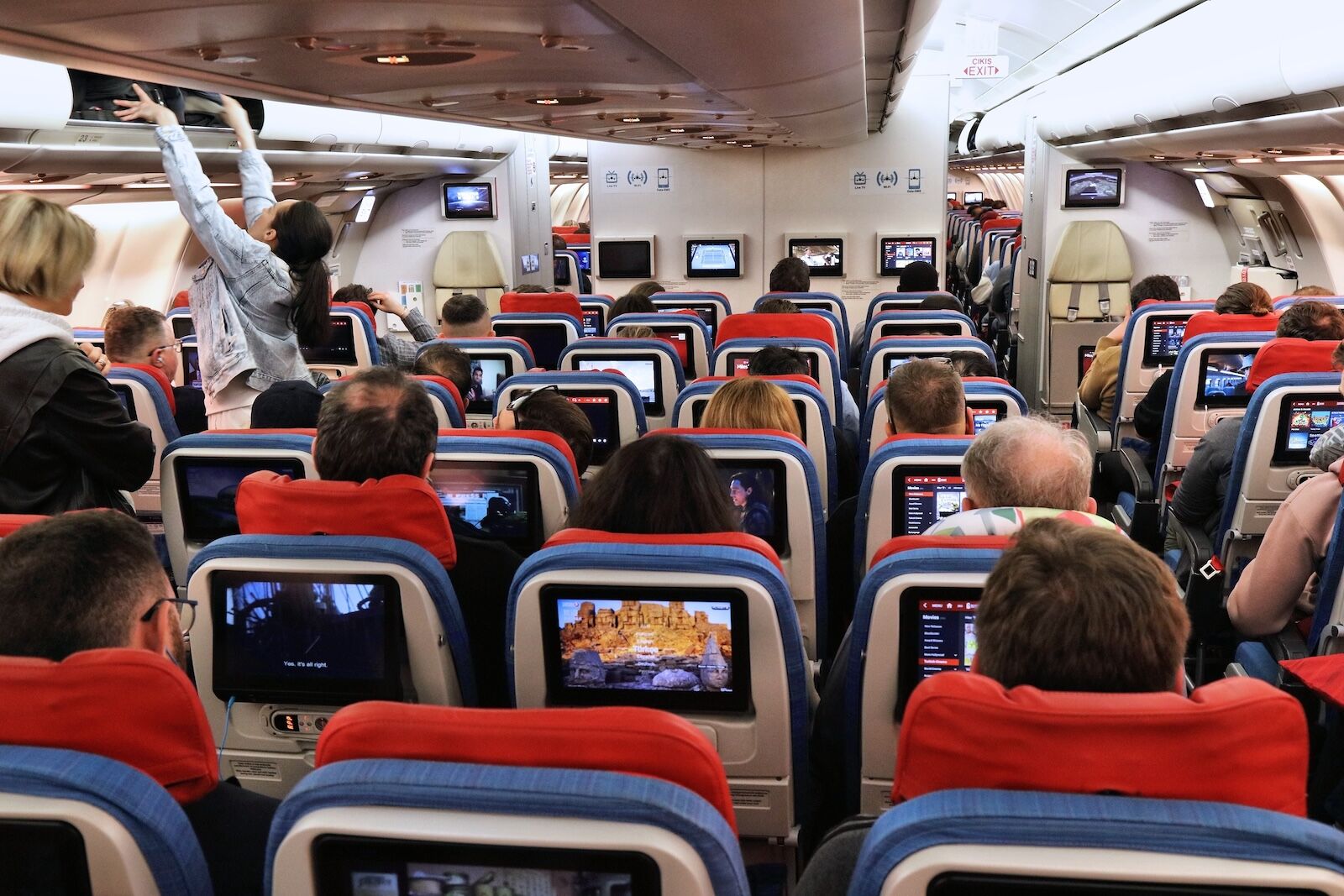 crowded economy class plane cabin