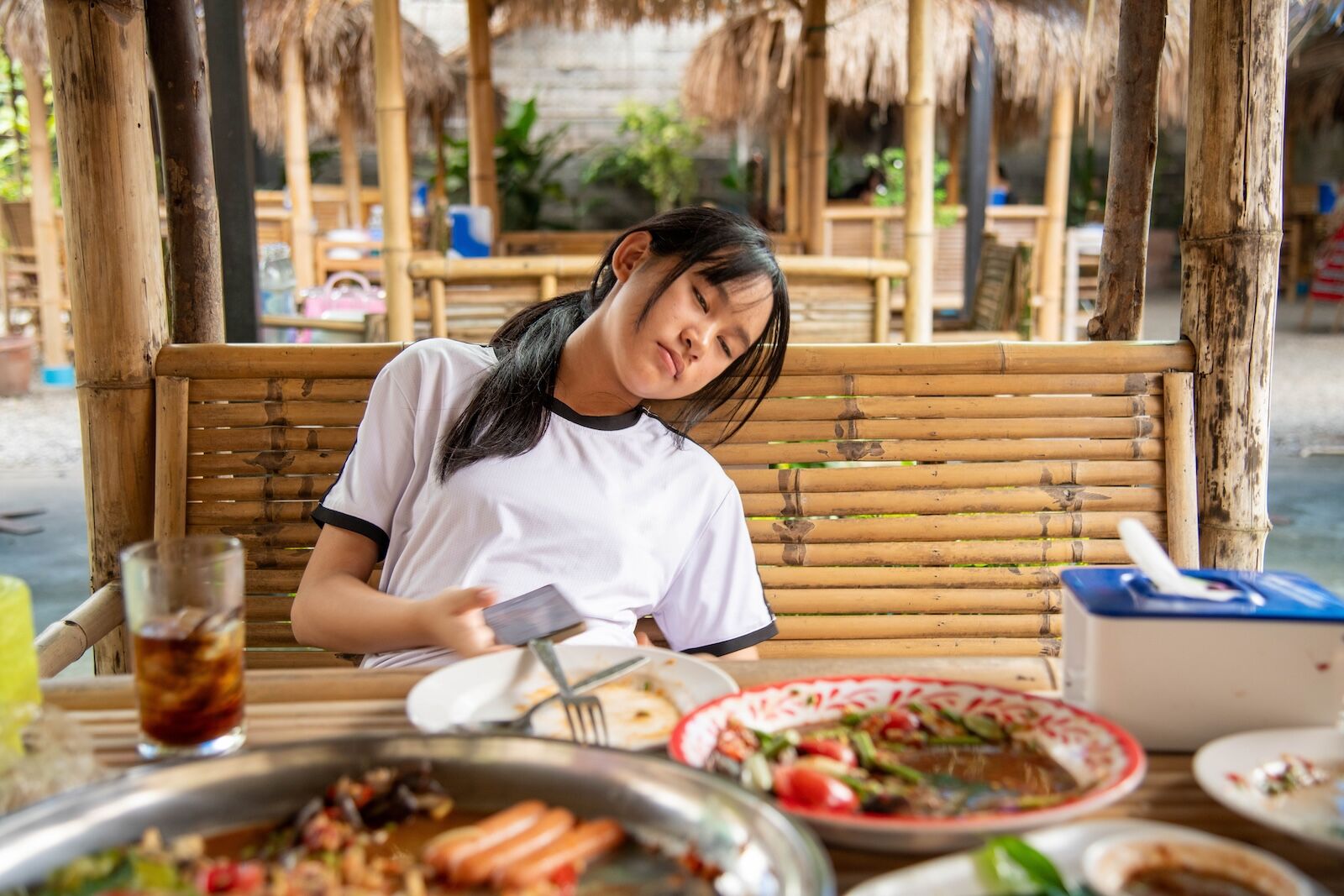 premium class worth it? woman sleeping at table