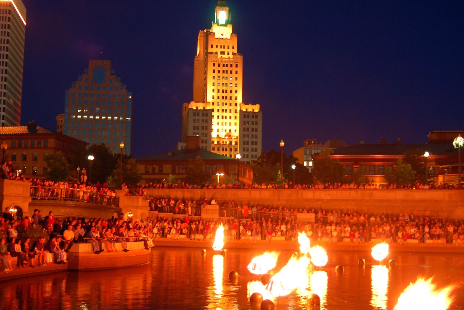 Providence, RI, USA August 17 A crowd gathers along the waterfront of Providence Rhode Island to enjoy the Waterfire event, where bonfires are lit on the waters of the city’s river