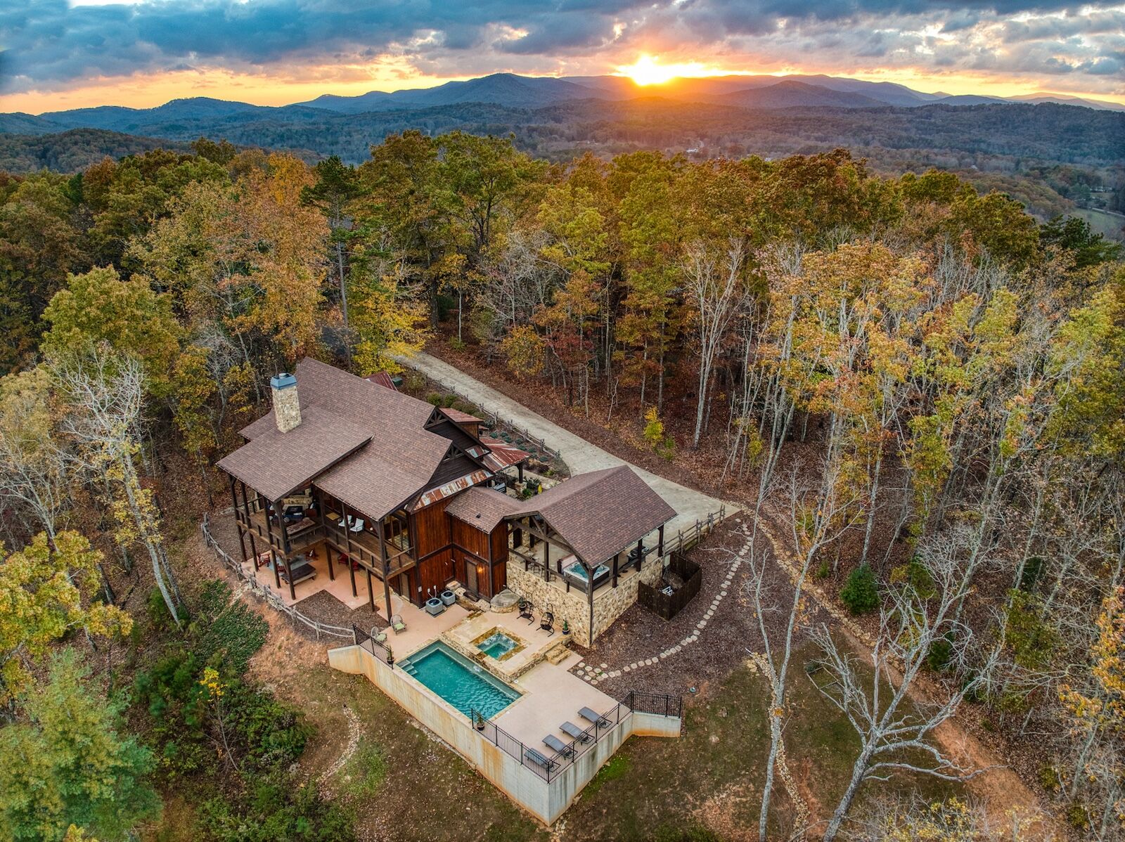aerial shot of large house airbnb in the woods
