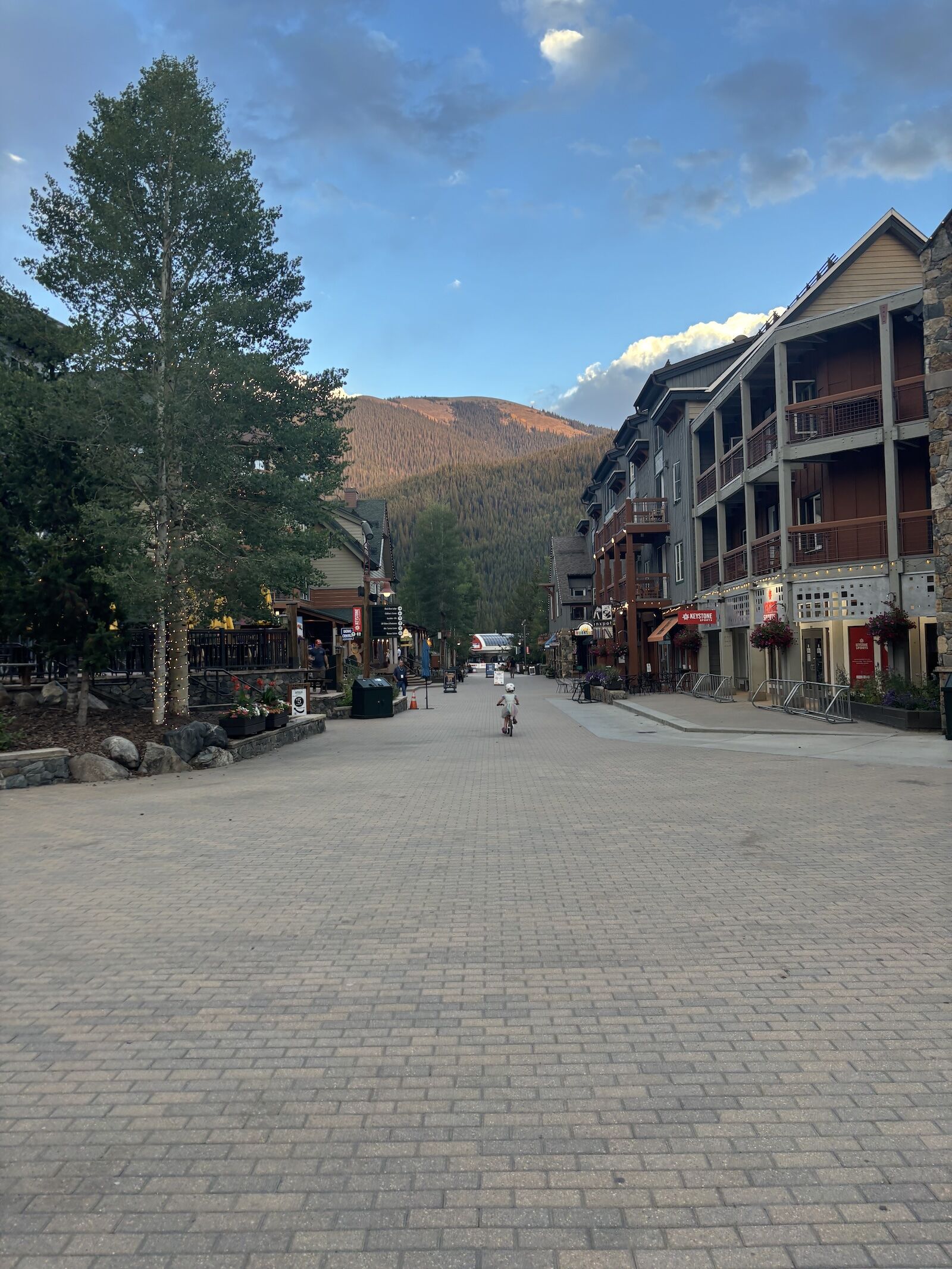 kid biking through keystone village
