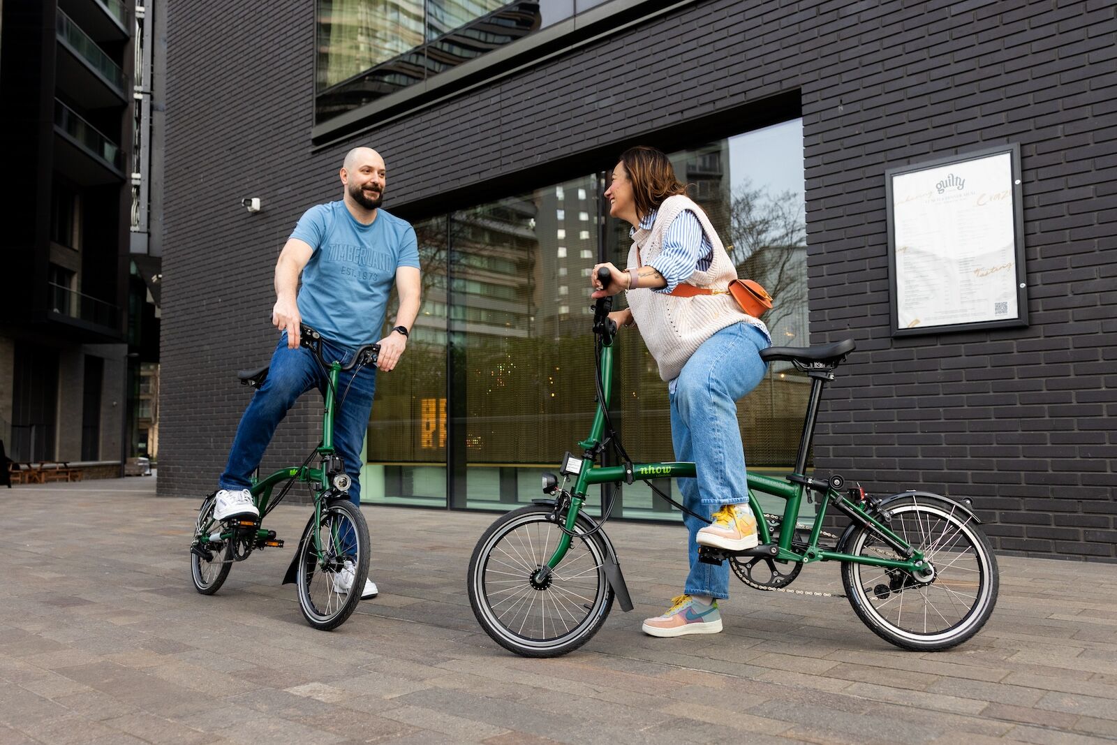 people on brompton bikes