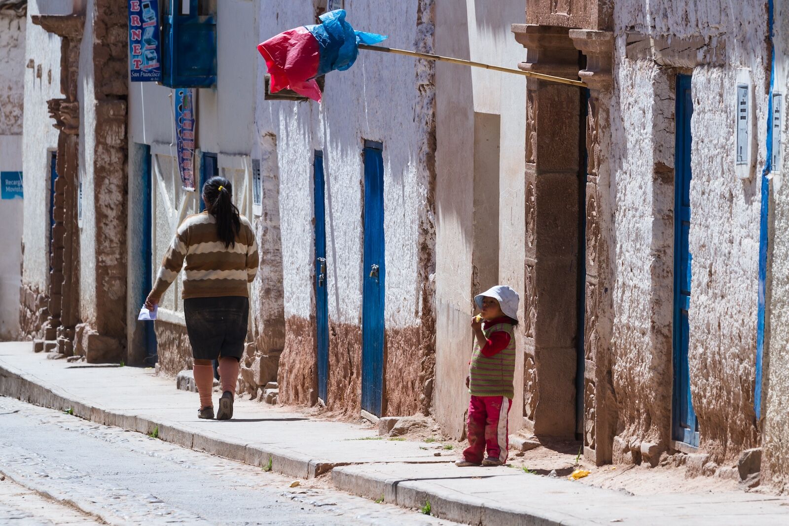 red flag outside chicheria in peru