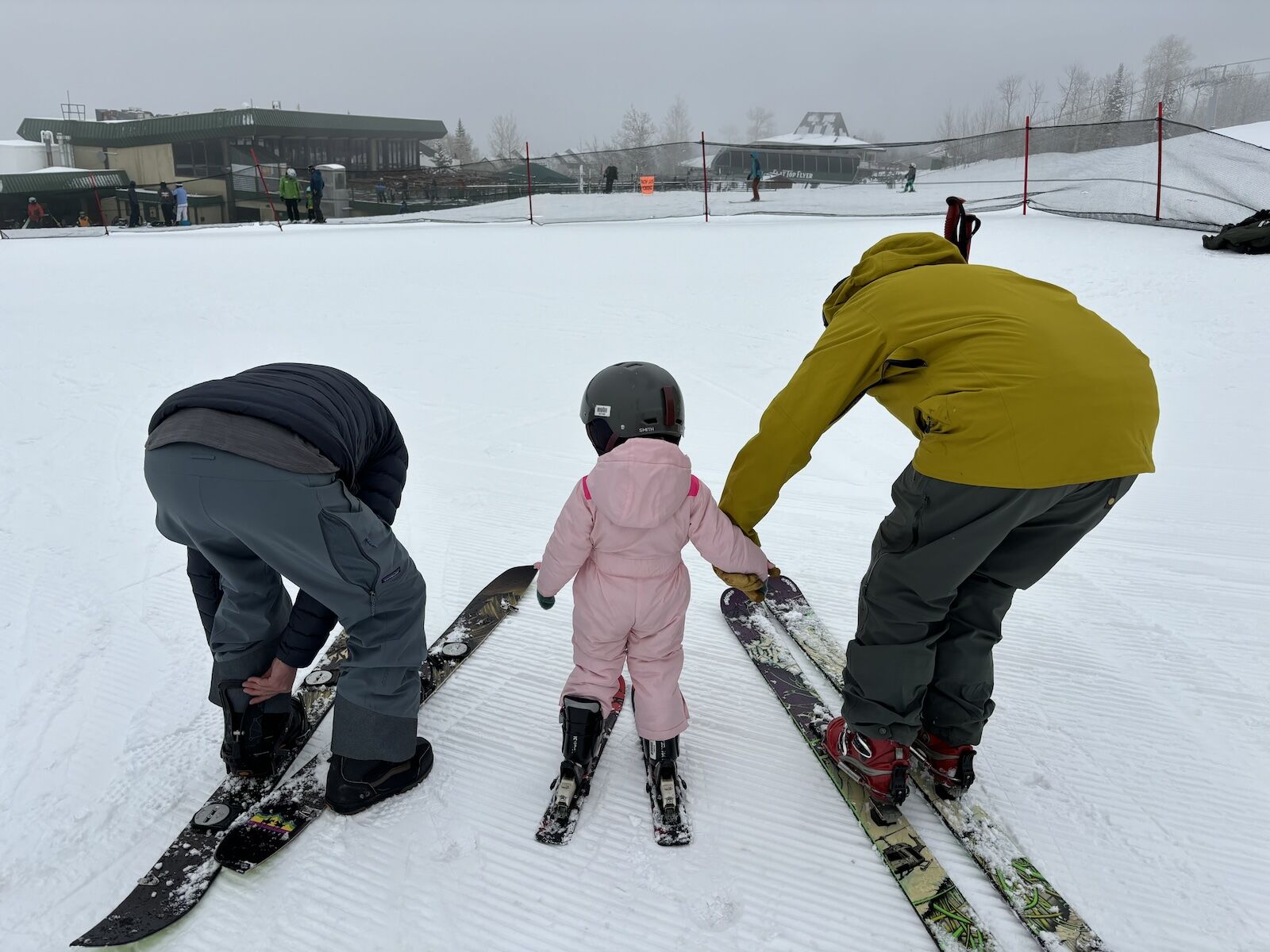 skiers and child on bunnyslope at powderhorn